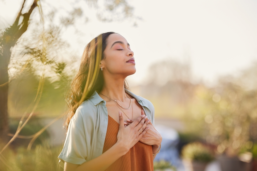 A woman soaking up the sun in nature